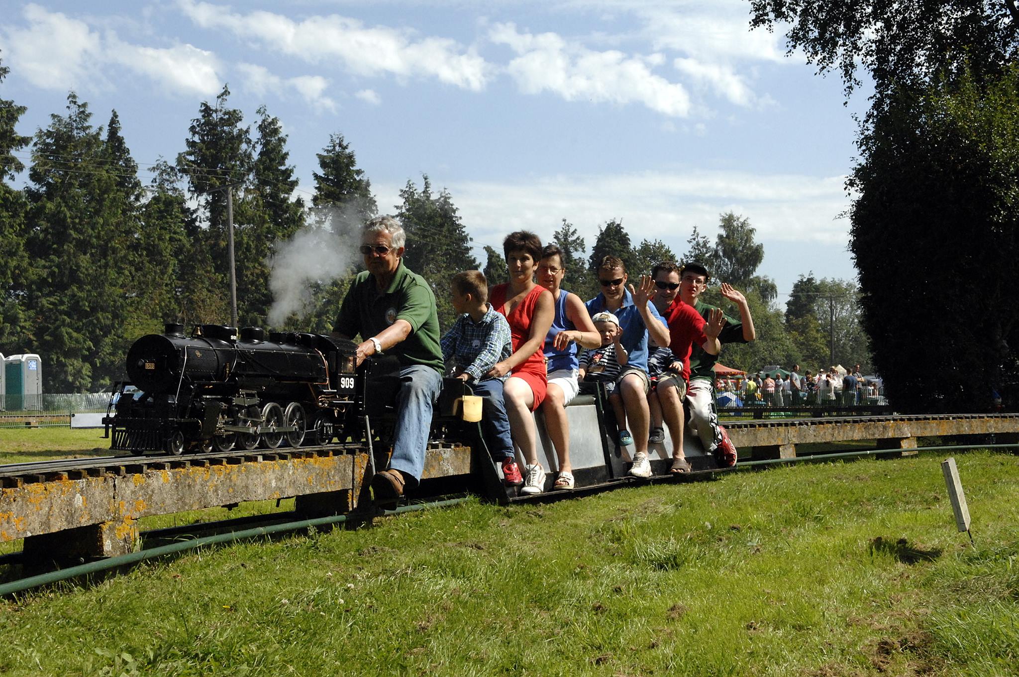 A steam locomotive takes passengers around the circuit at the Canterbury & District Model Engineering Society