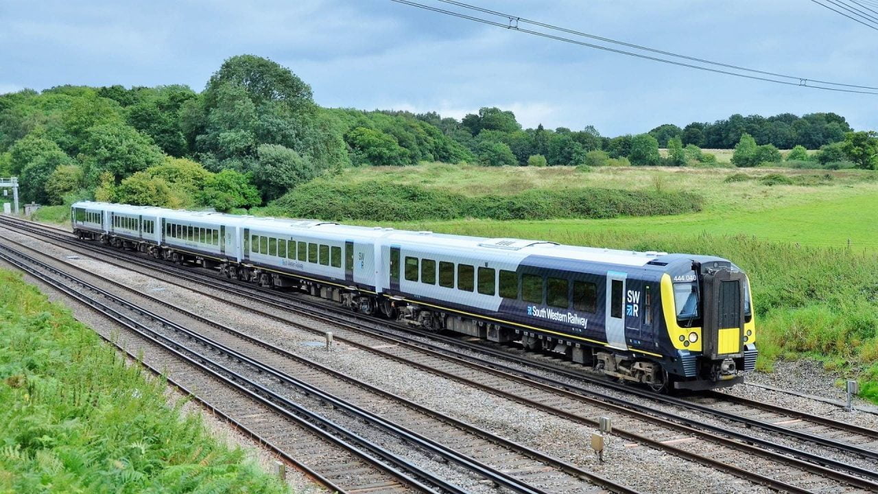 444040 working 3Z01 London Waterloo - Northam passes through Potbridge.