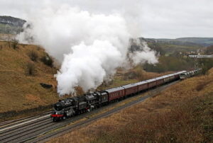 steam locomotives 76084 anmd 45690 leander on their way to buxton