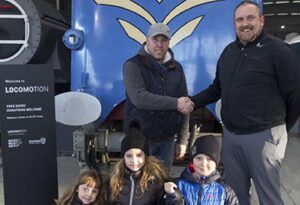 Sean and his Family with Museum Manger Gary Campbell // Credit NRM