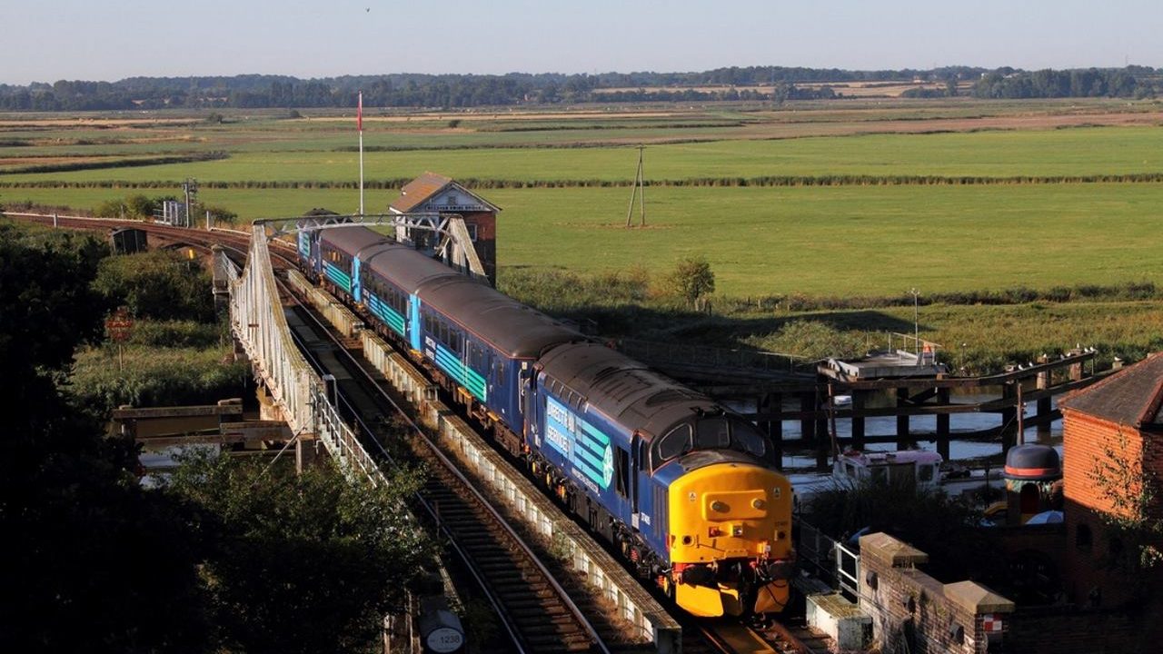 Two Class 37 diesels top and tail a service train over the Reedham Swing Bridge in 2016