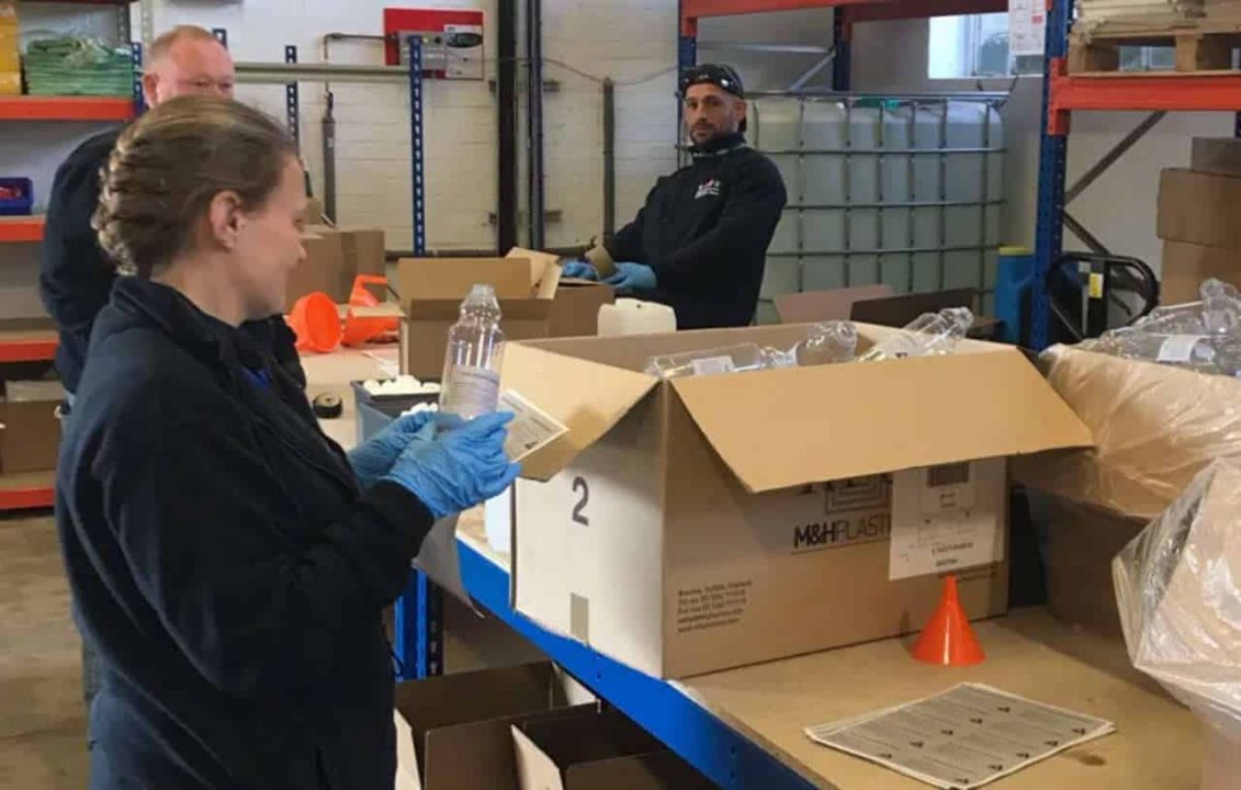 Railway team help pack sanitiser at train depot