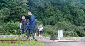 A group walk along the railway track at Harlech