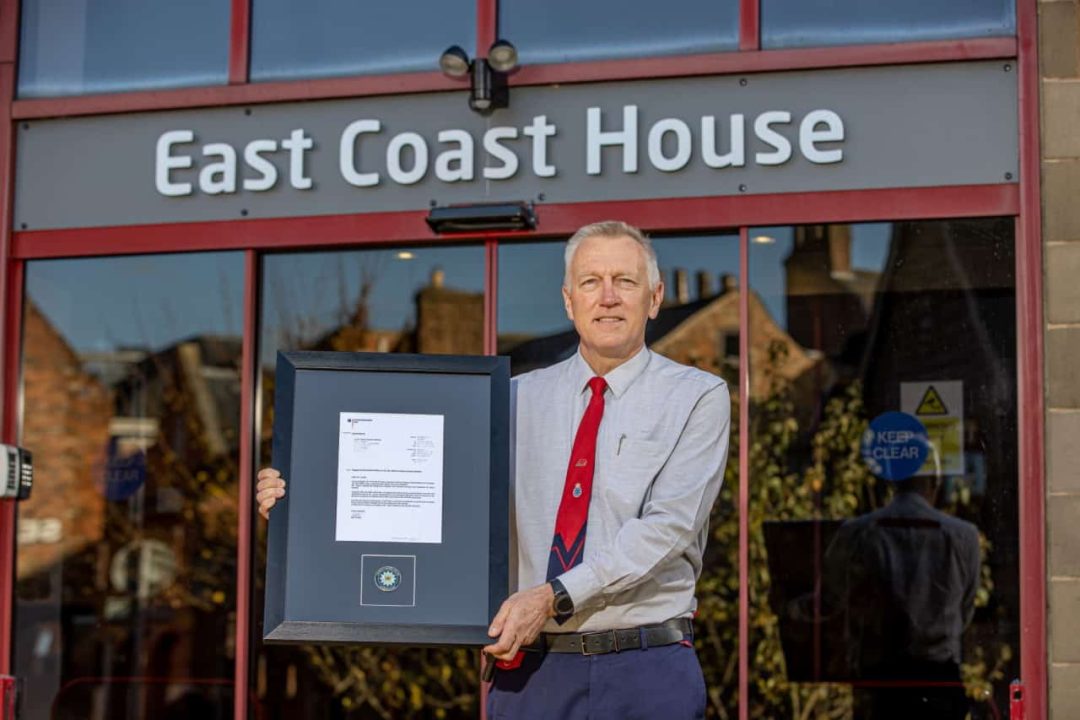 Paul Taylor with his letter and challenge coin outside the LNER HQ