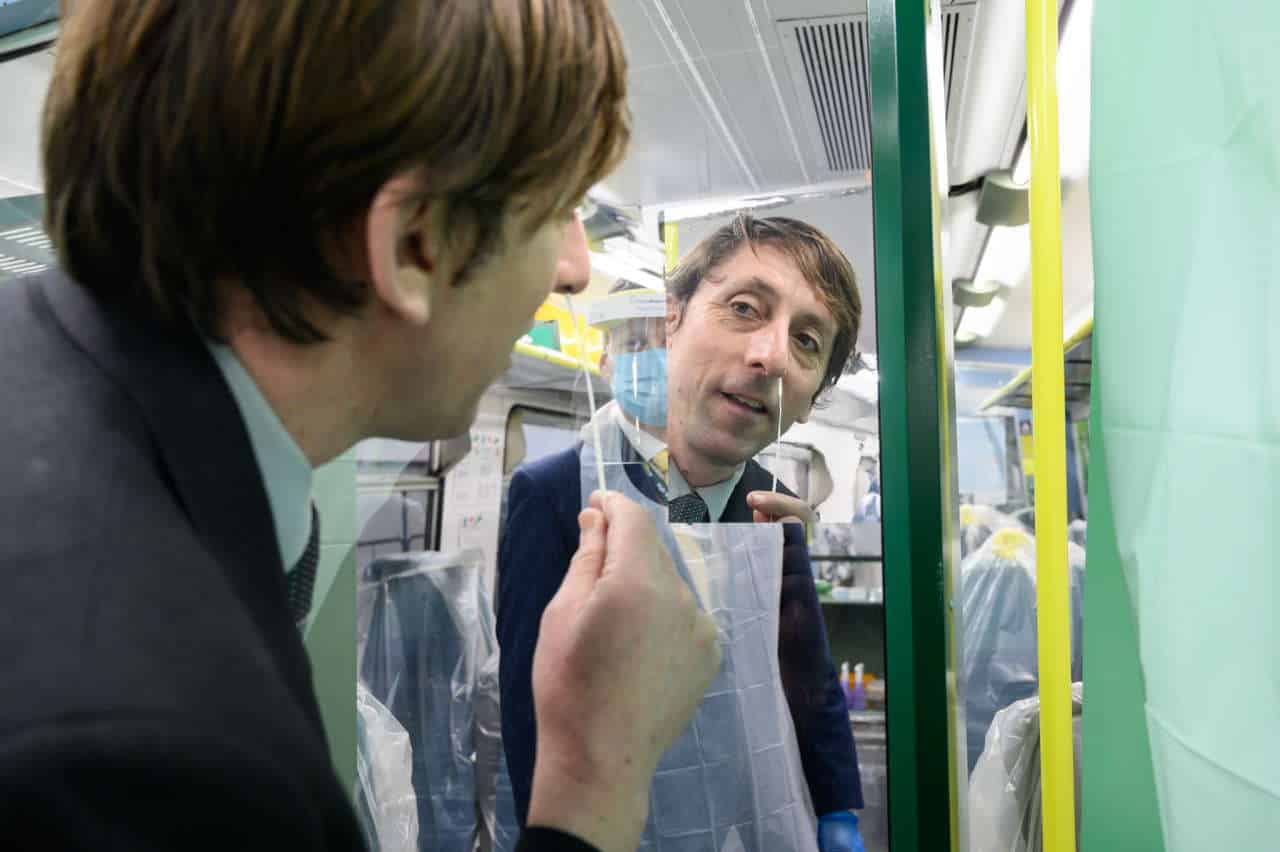 Team leader Jeremy Moss carries out a swab test on board the Southern train at Brighton station