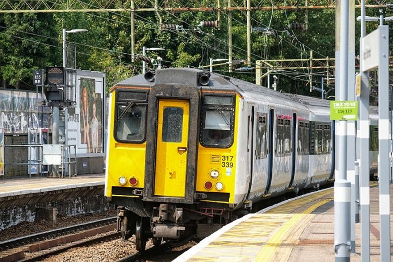 A Train on the line at a station 317339