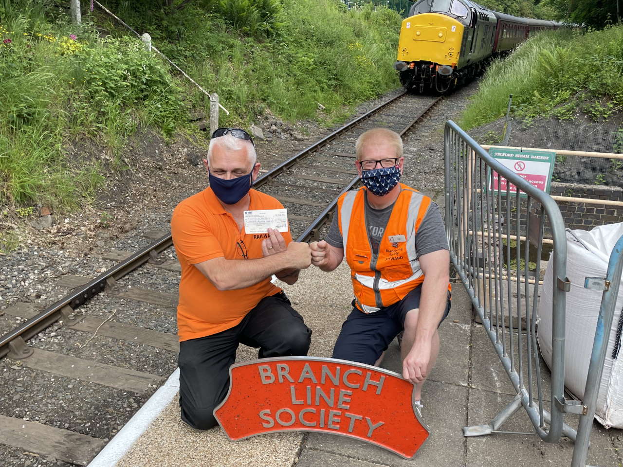 Kevin Adlam (right) presenting a cheque for 3000 to the Telford Steam Railway