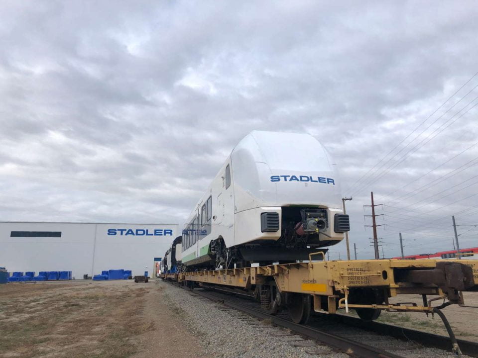 The first DMU for SBCTA loaded on flat beds and ready for pick-up in front of the Stadler US facility in Salt Lake City, UT.