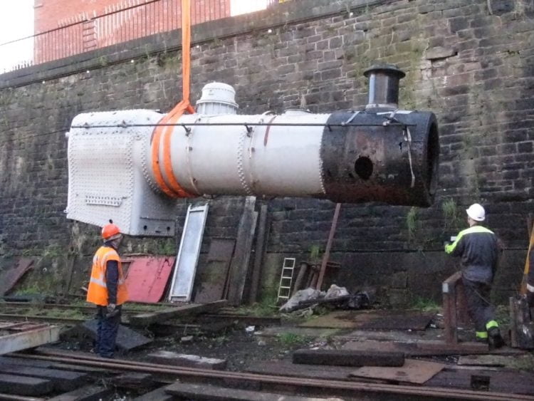 Craning the Ivatt boiler into position outside the workshop.