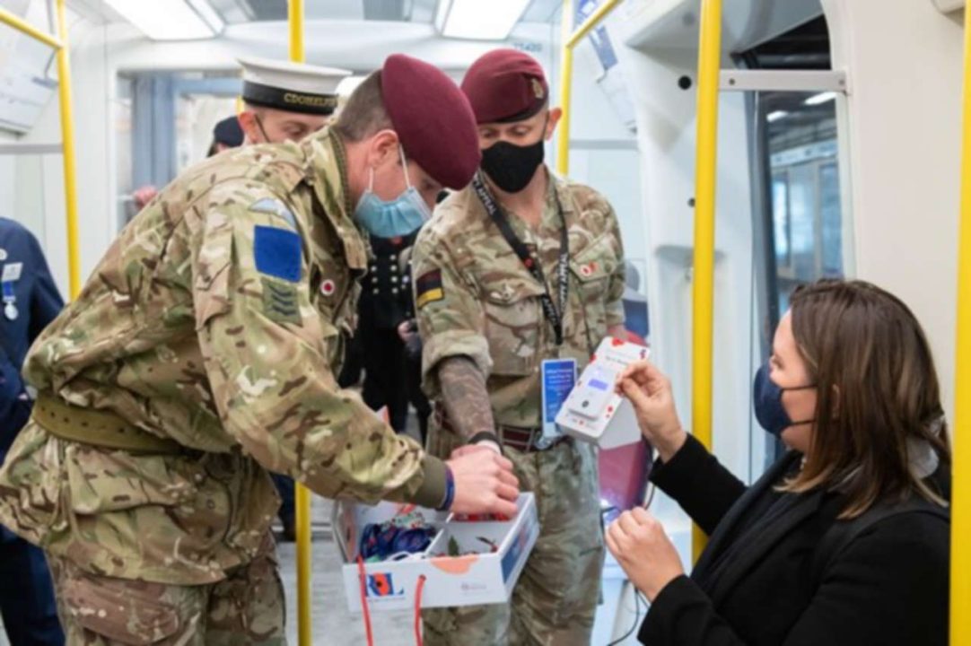 poppys handed out on a train