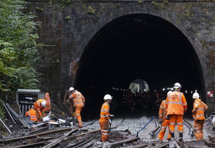 Work inside the tunnel and outside preparing the line for reopening