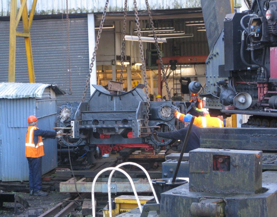 The Ivatt frame being lowered onto the transit bogeys outside the Group’s workshop