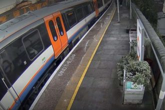 Investigation carried out after passenger trapped in doors at London railway station