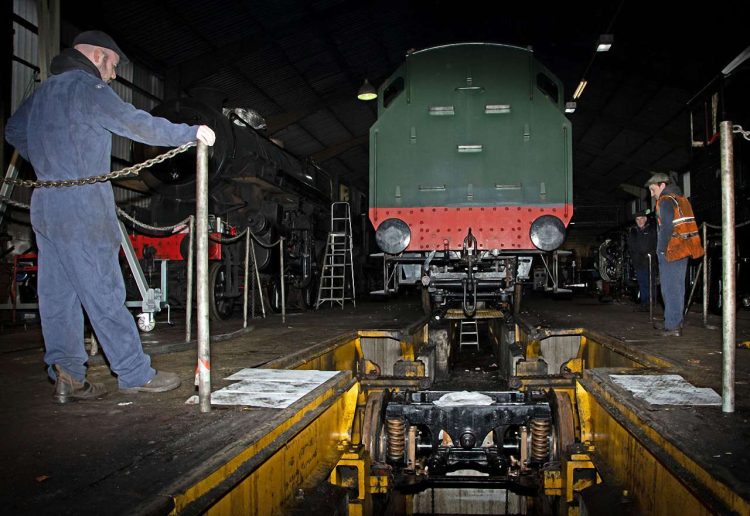 The rear pony truck of 82045 are being lowered in the wheel drop. Photo: John Titlow.