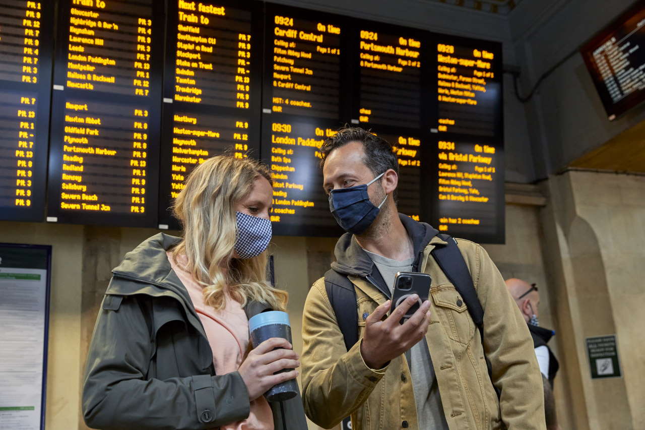 people infront of a digital board