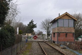 Storm Eunice fails to stop former Spooner Row signal box moving to Wymondham Abbey on MNR 