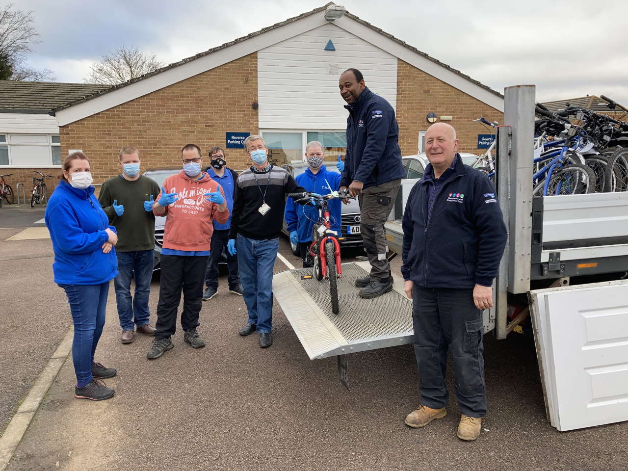 TAG Bikes trainee mechanics and their trainer take delivery of abandoned bikes from GTR’s Courtney Franklin and Paul Harknett