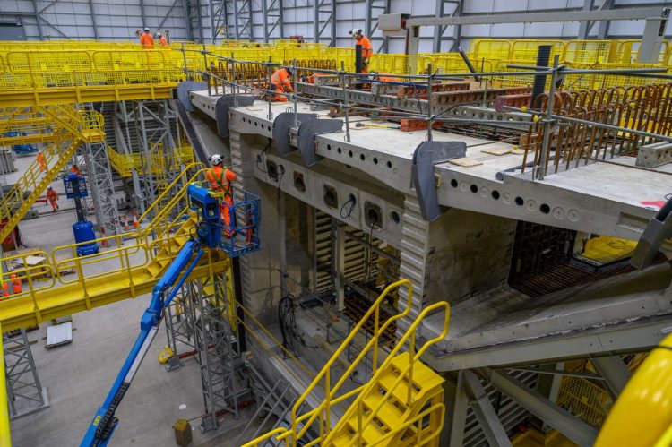 Workers checking the first segment of the Colne Valley Viaduct landscape Feb 2022