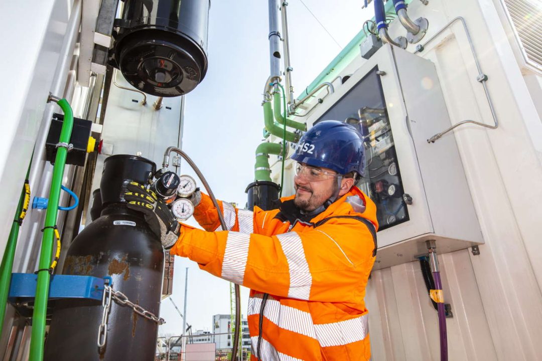 Worker checking valves, Victoria Road, March 2022