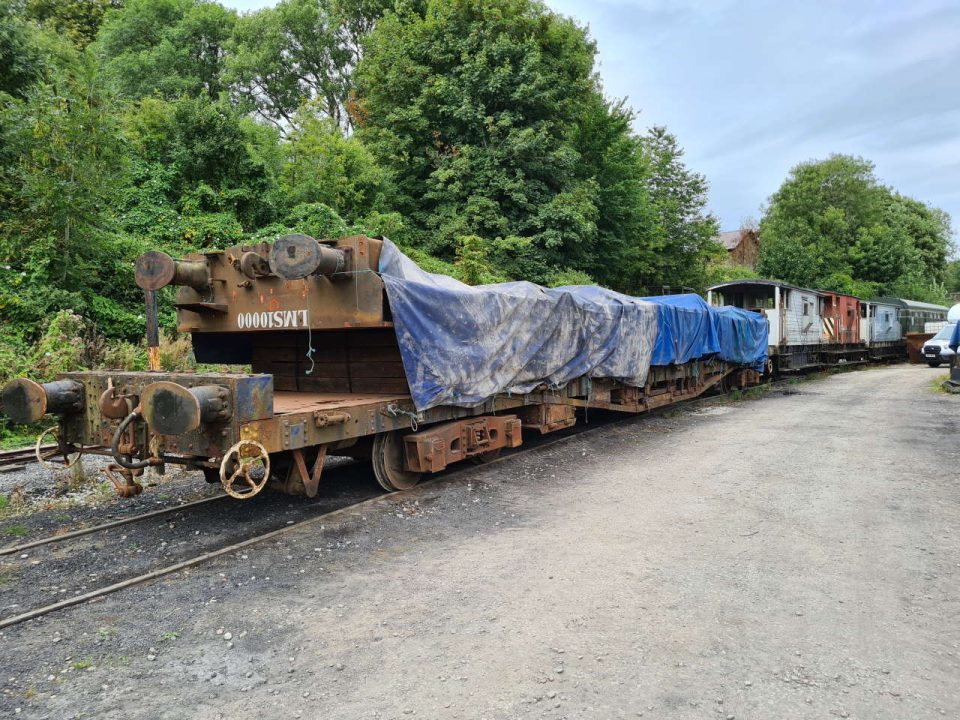 The completed task and the chassis wrapped in tarpaulin