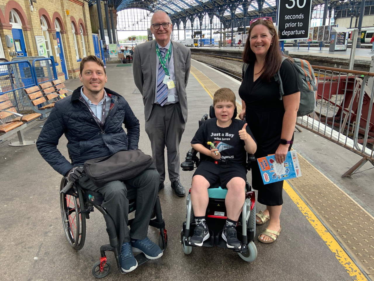 Just a boy who loves trains: 13-year-old Ryan Horrod has been given the confidence to continue travelling by train. Pictured are (from left) GTR Accessibility Lead Carl Martin, Southern's Area Station Manager Graham Thrower, Ryan and his mum, Anne at Brighton Station