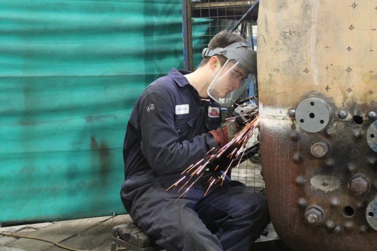 Jack Kerswill working on a boiler 