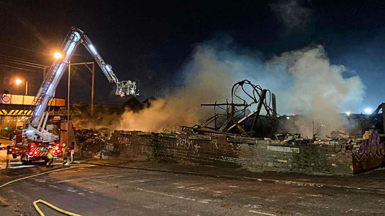 Wall after overnight demolition of fire damaged Wolverhampton warehouse