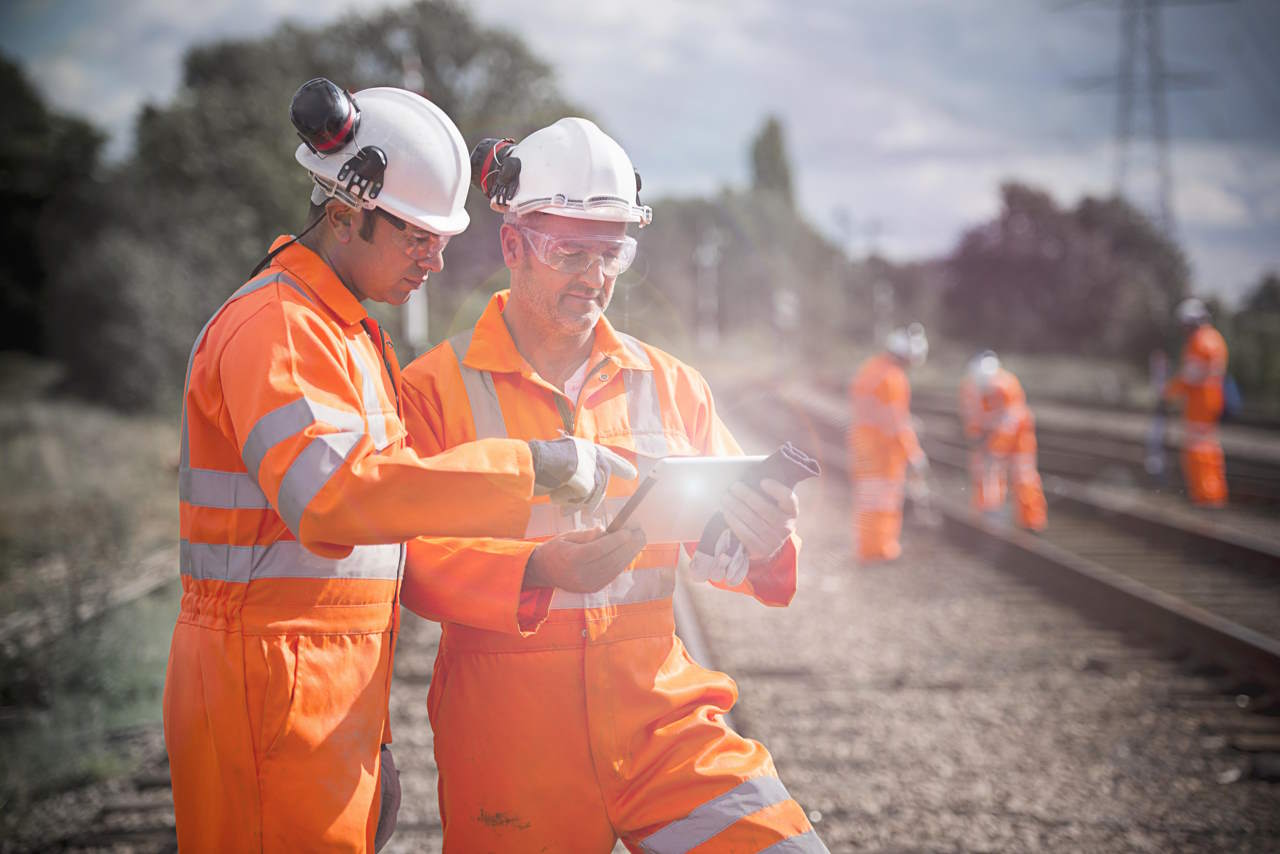 Railway workers using tablet computer