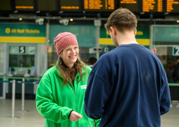 A Samaritans volunteer talks to a member of the public about the campaign