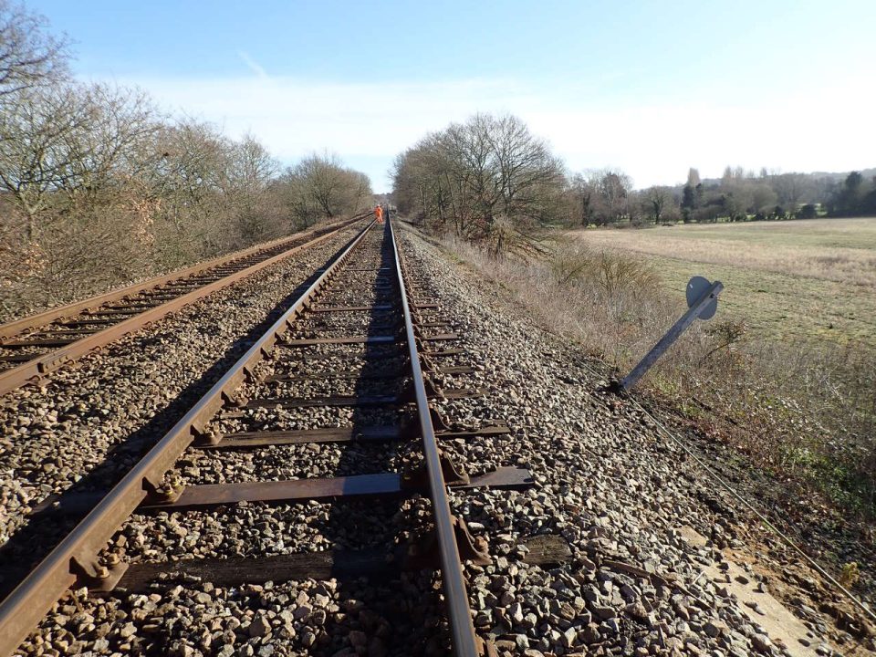 Signage slipping down the deteriorating embankment