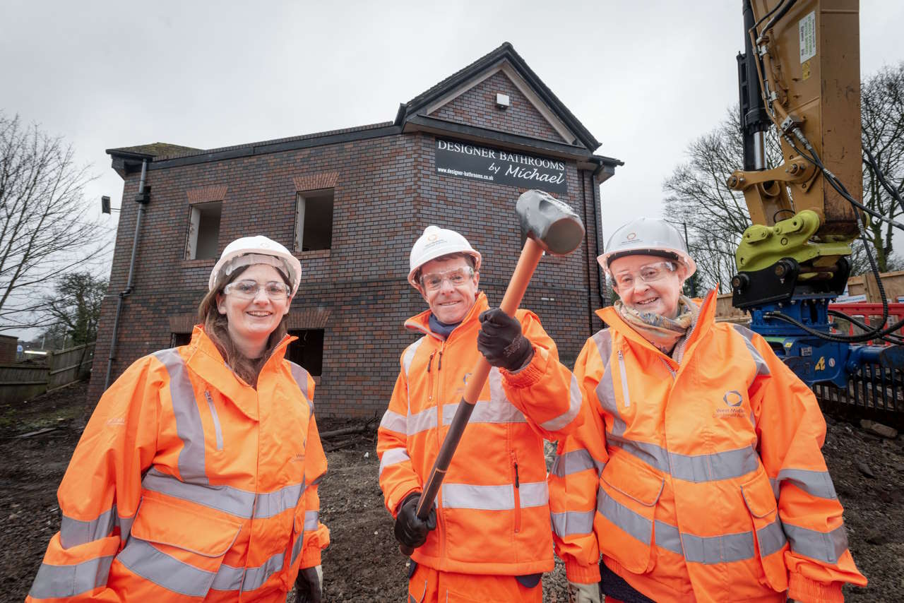 Cllr Brigid Jones, Mayor Andy Street and Cllr Mary Locke ready to watch the old showroom behind being demolished