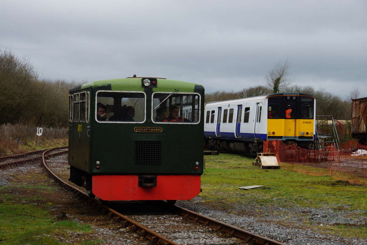 ex-MOD railcar AD9117 and Class 315 No. 315856