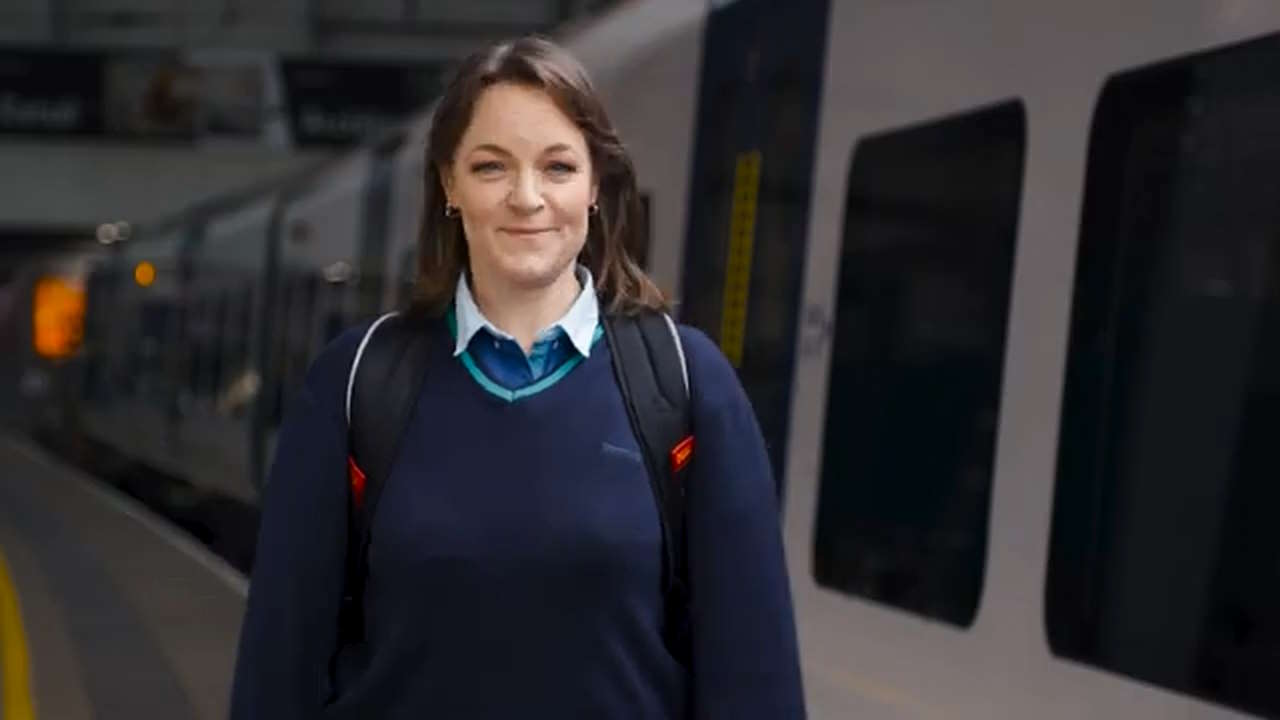 Katy standing next to a Northern train