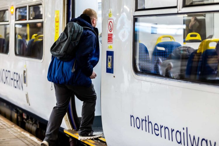 Customer boarding a Northern train