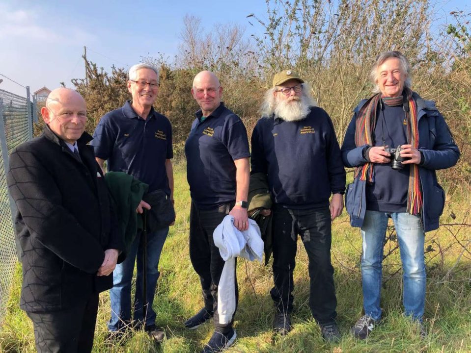 Greater Anglia's Alan Neville, left, with members of North Lowestoft Men's Shed at the former station cattle dock.