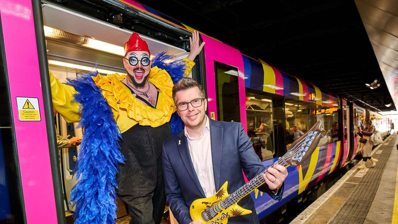 Drag queen Fatt Butcher with LNR customer experience director Jonny Wiseman and the Eurovision train