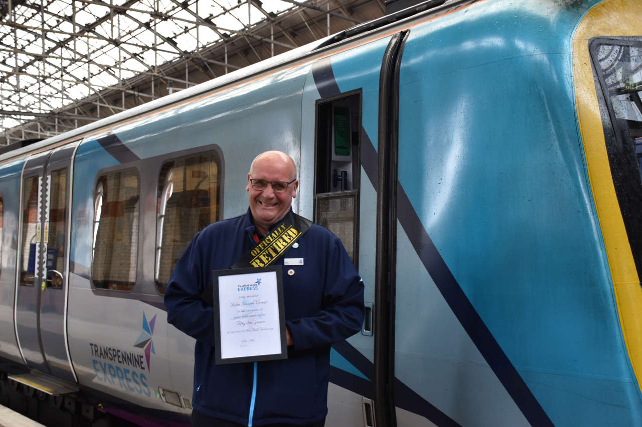 Joe Crean with his retirement certificate