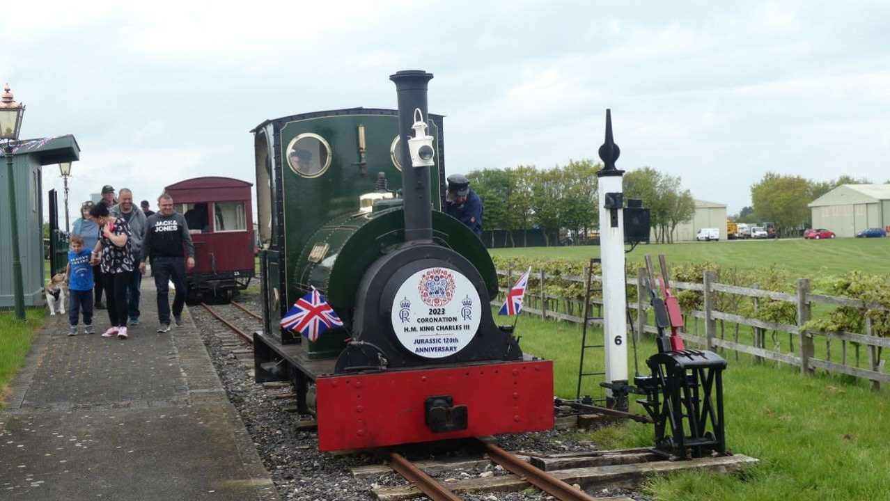 Proudly carrying its Coronation and “birthday” headboard, the 1903-vintage steam locomotive Jurassic arrives at Walls Lane station on the Lincolnshire Coast Light Railway (photo: Chris Bates/LCLR).