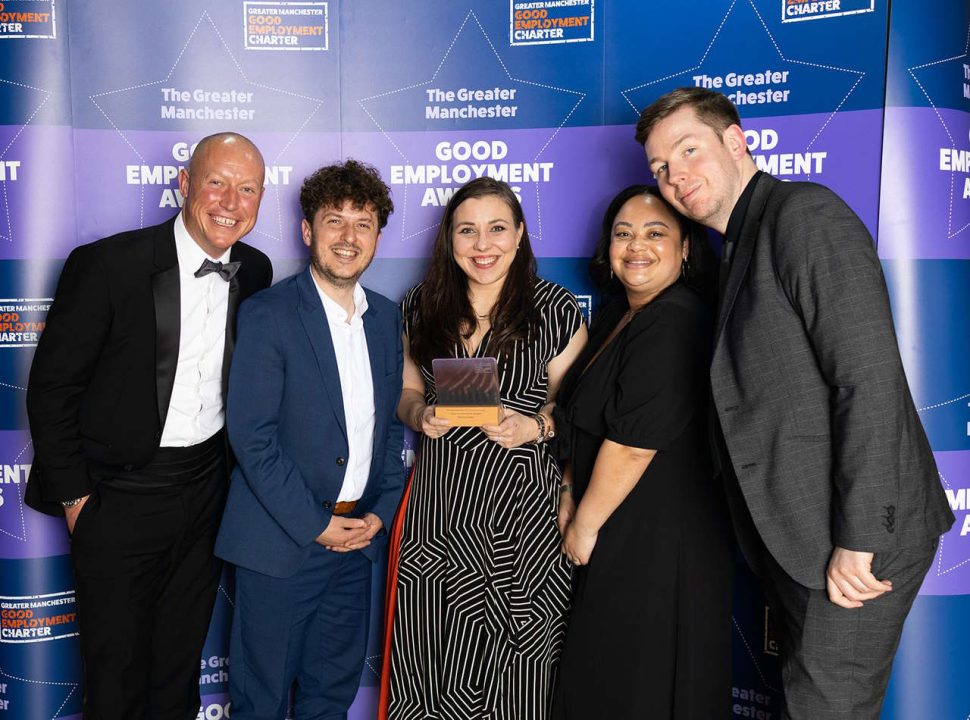 This image shows the Northern team holding their award