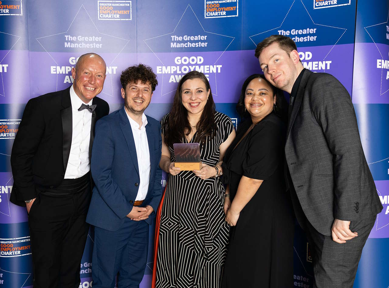 This image shows the Northern team holding their award