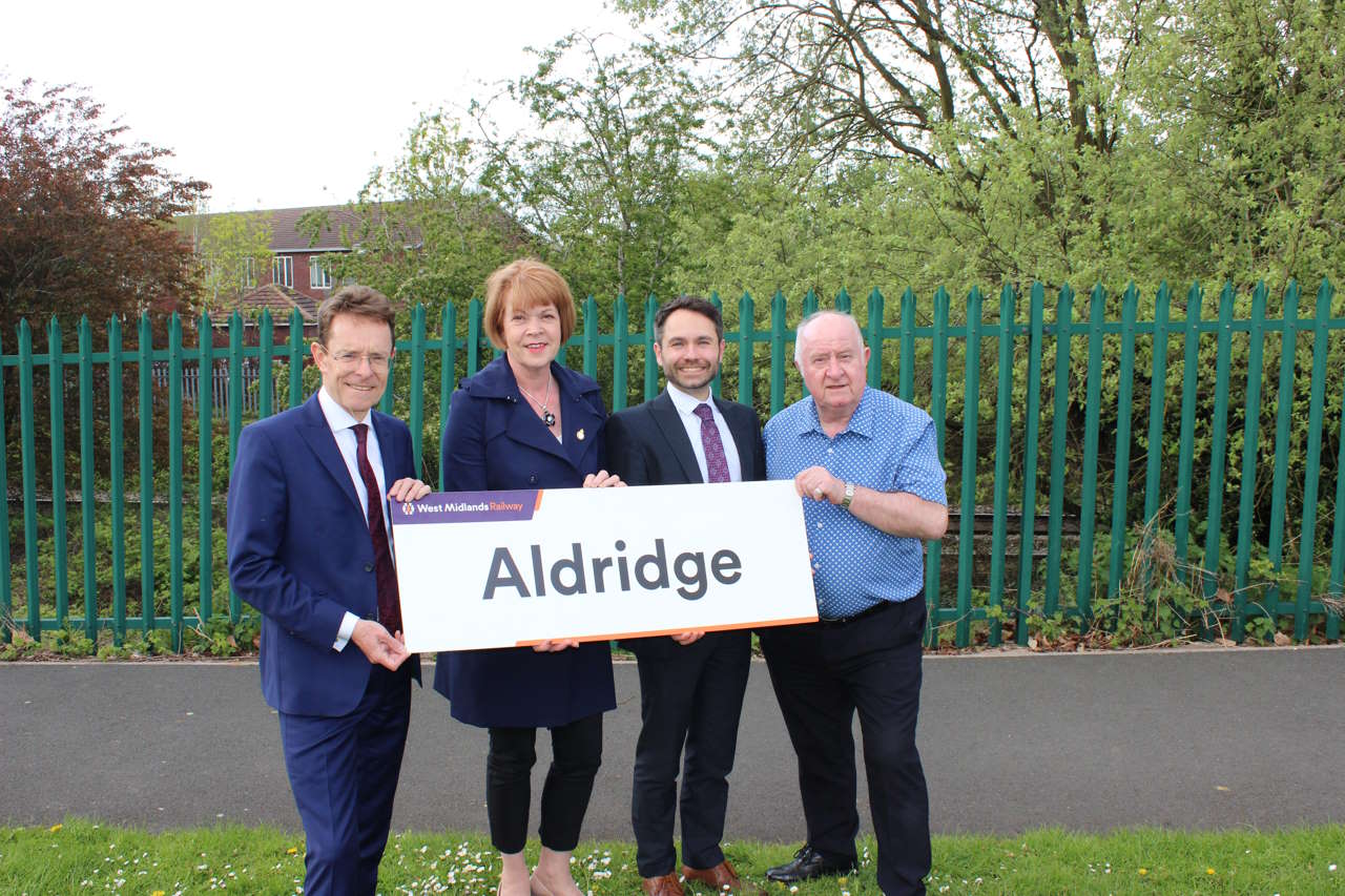 West Midlands Mayor Andy Street, Aldridge and Brownhills MP Wendy Morton, director of rail for TfWM Tom Painter and Walsall Council leader Cllr Mike Bird in front of the railway line and station site