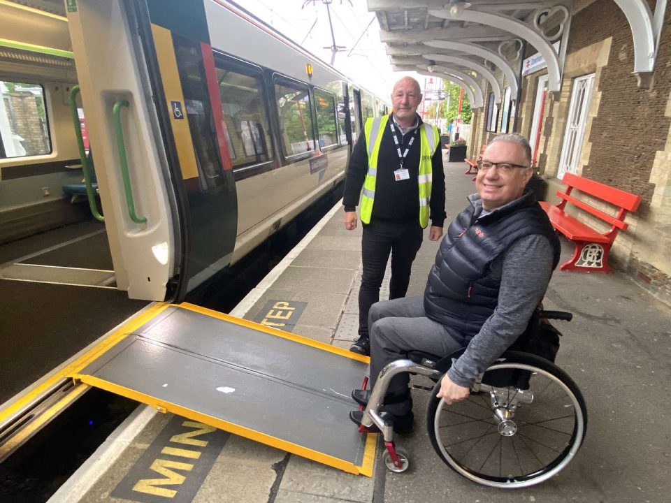 Downham Market - mobile assistance team member John Francis assists passenger Gio Strawbridge