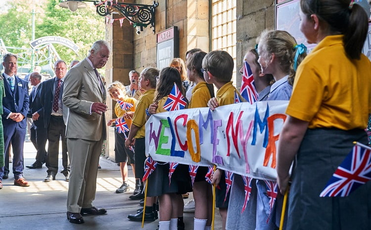 King Charles III is welcomed to NYMR by a group of schoolchildren