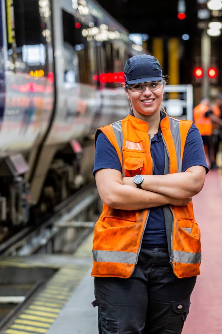 Kate Towns next to a Northern train