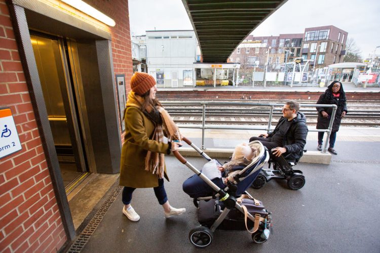 Mobility scooter user Andy uses a lift at Brockley station