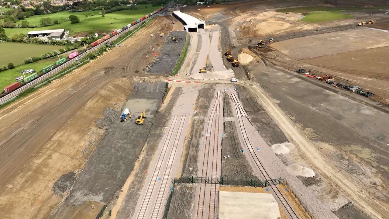 Drone shot of West Coast main line and soon to be built freight connection in Northampton