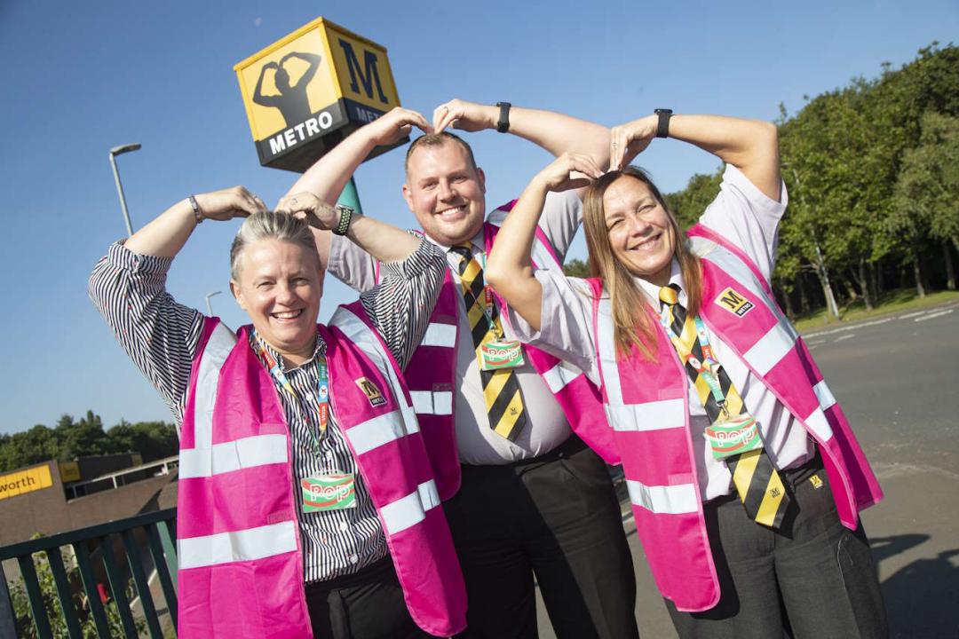 Metro customer service team with the MetMo station cube at Heworth Interchange in Gateshead.