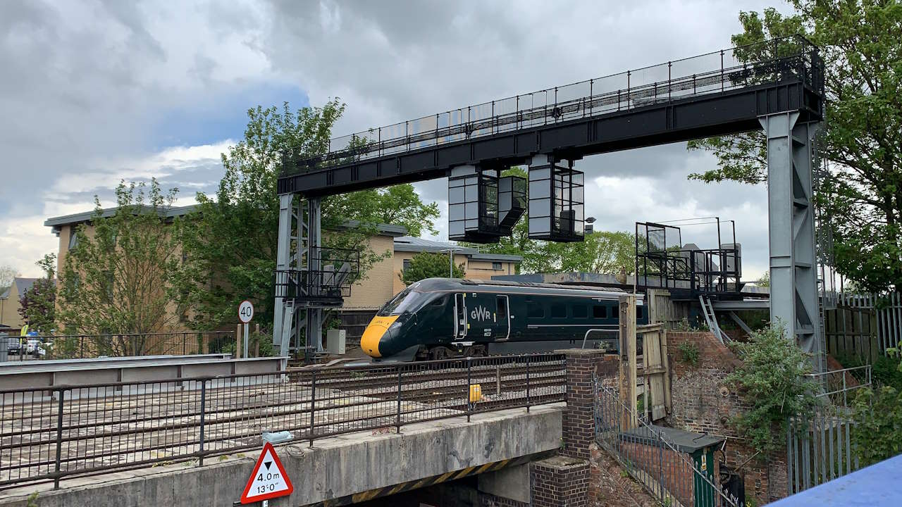 Great Western Railway train leaving Oxford station and passing over Botley Road Bridge