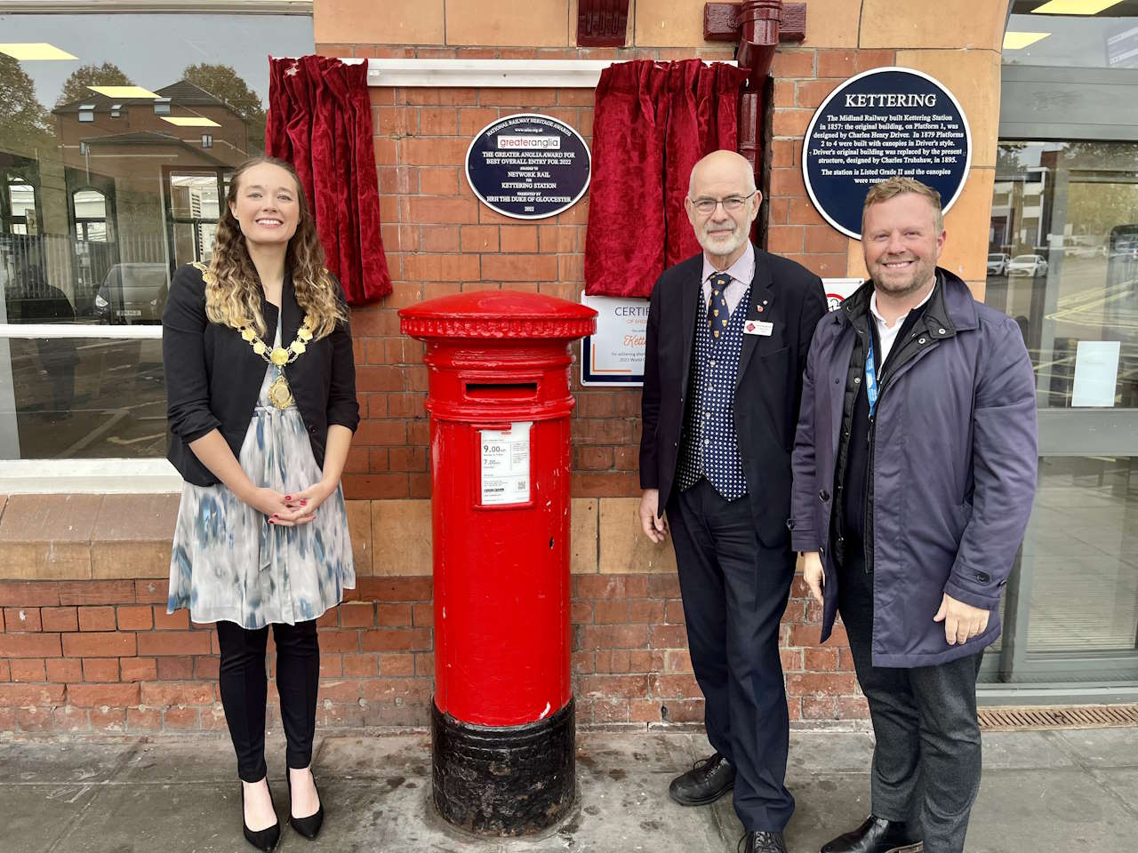 Cllr Fedorowycz, Andy Savage and Colin Ramshall alongside the Kettering heritage plaque