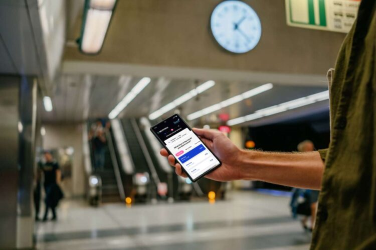 Holding a Google Pixel 6 mockup at the subway station (Mockuuups Studio)@2x